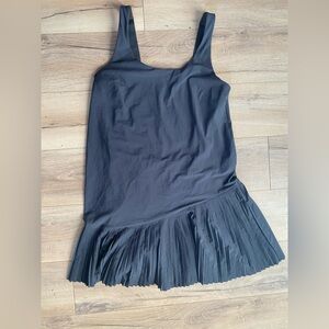 Spanx black tank tennis dress with asymmetrical pleated skirt size small